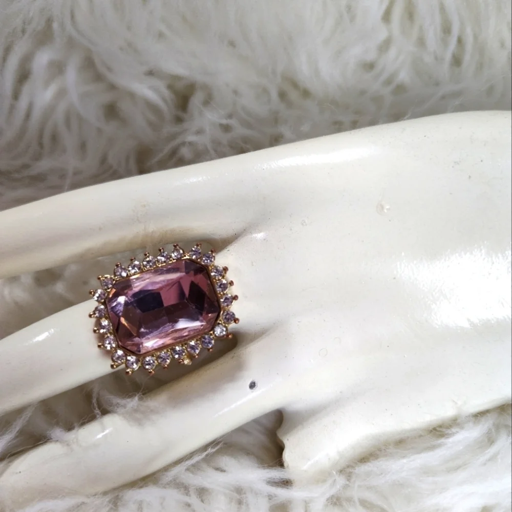 Large pink 3ct cubic zirconia with clear round cubic zirconia gold ring size 6